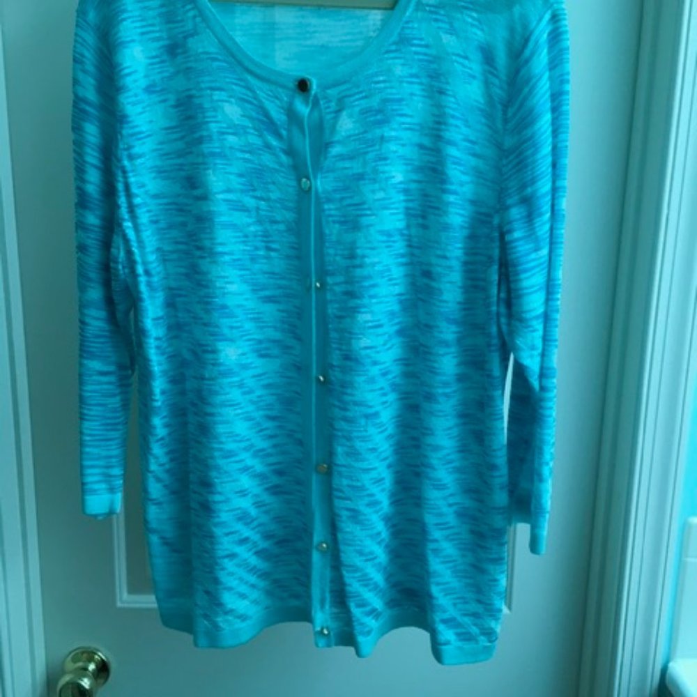 A lightweight turquoise sweater for spring and summer